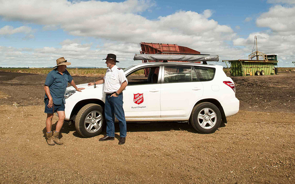 Farmer talking with a Salvo chaplain